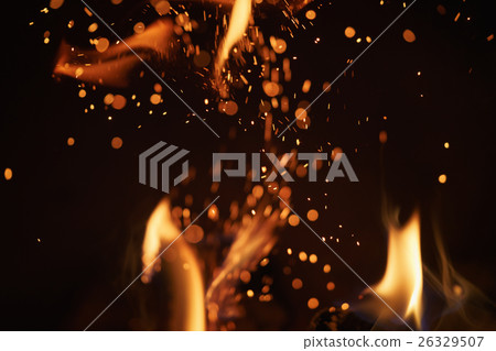 close up of charcoal burning in fireplace 26329507