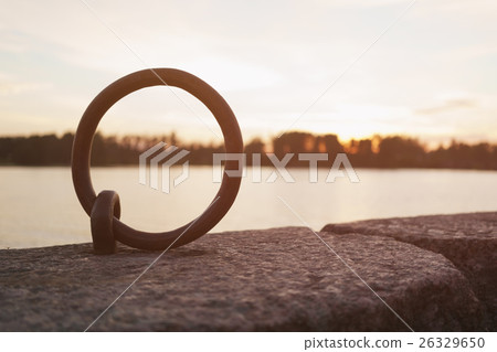 mooring ring on river bank for boats in sunset mooring ring on river bank for boats in sunset 26329650