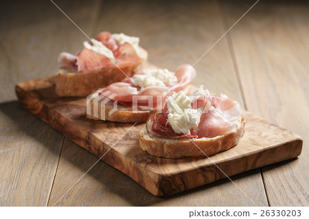 simple ciabatta slices with speck and mozzarella simple ciabatta slices with speck and mozzarella 26330203