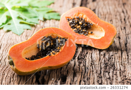 sliced papaya fresh fruit on wood background sliced papaya fresh fruit on wood background 26331274