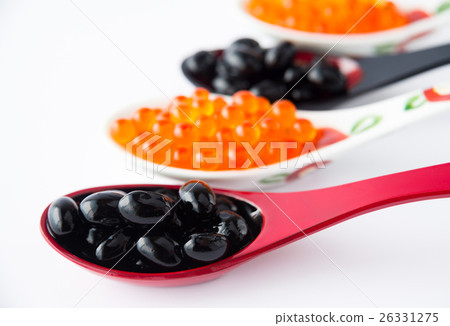 Salmon roe and black beans served on a spoon Served with spoon 26331275