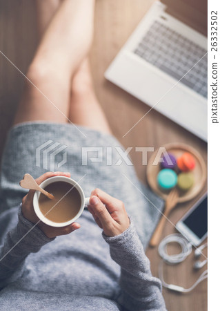 Young woman relaxing at cozy home atmosphere 26332502