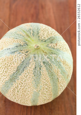 melon on brown background melon on brown background 26332612