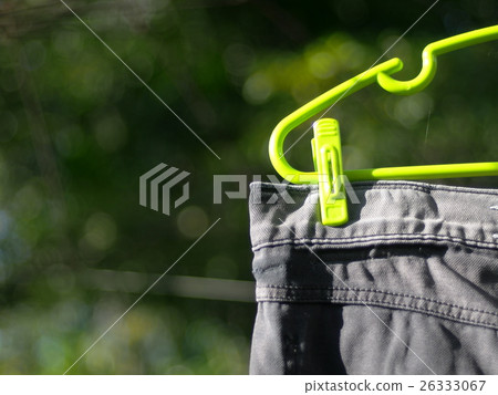 closeup crop on washed cloth hanged in green house closeup crop on washed cloth hanged in green house 26333067