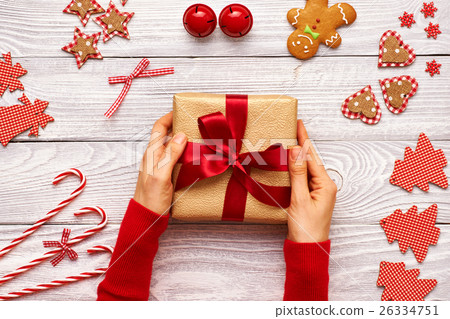 Woman holding christmas present Woman holding christmas present 26334751