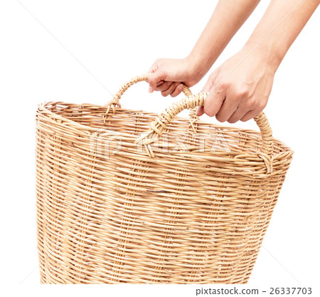 Woman's hand hold the wicker baskets on white Woman's hand hold the wicker baskets on white 26337703