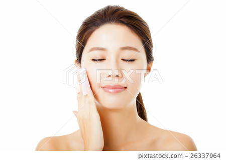 young woman cleaning her face with cotton 26337964