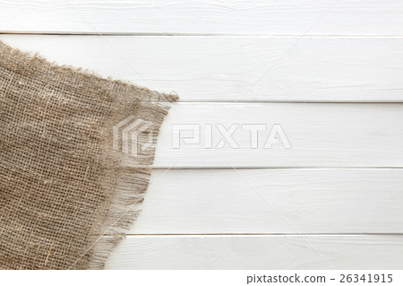 Burlap on white wooden background Burlap on white wooden background 26341915