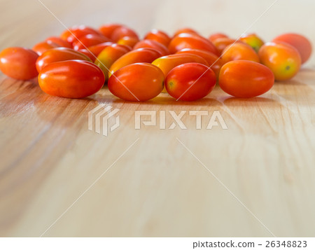 Cherry Tomatoes on pine wooden table. 26348823