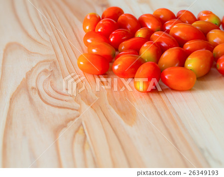 Cherry Tomatoes on pine wooden table. 26349193