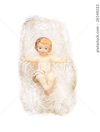 Christ child figurine in angel hair on white backg Christ child figurine in angel hair on white backg 26349283