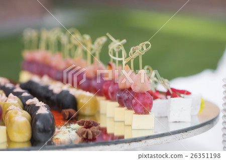 Catering banquet table with baked food snacks Catering banquet table with baked food snacks 26351198