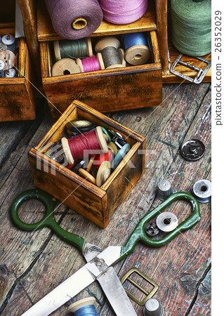 cupboard with threads and buttons 26352029