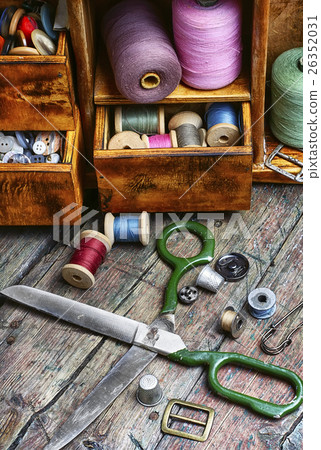cupboard with threads and buttons 26352031