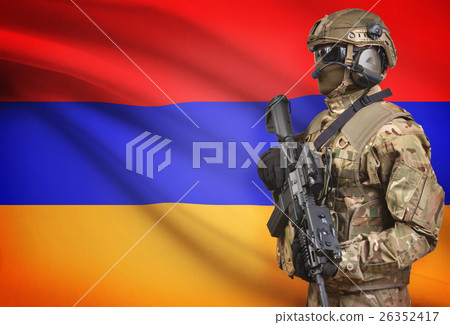 Soldier in helmet holding machine gun with flag on background series - Armenia Soldier in helmet holding machine gun with flag on background series - Armenia 26352417