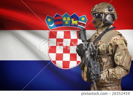 Soldier in helmet holding machine gun with flag on background series - Croatia 26352459