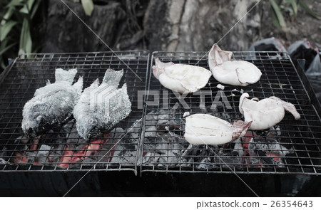 Tilapia baked and grilled squid Tilapia baked and grilled squid 26354643