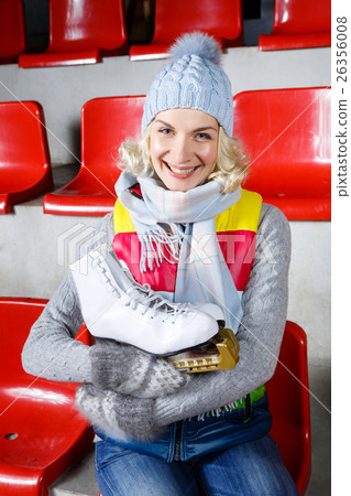 Beautiful girl in winter clothes with skates Beautiful girl in winter clothes with skates 26356008