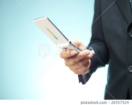A businessman to check mobile phones (Garaka). 26357324