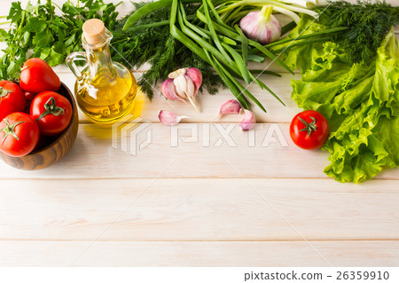 Tomato, olive oil, and garlic on wooden background 26359910