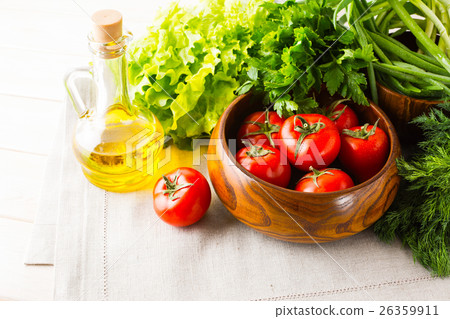 Vegetables and olive oil on the white wood 26359911