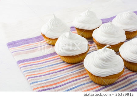 White birthday cupcakes on striped  linen napkin 26359912
