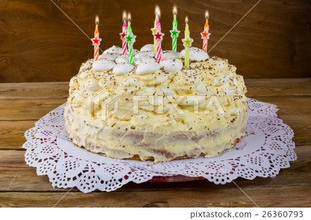Birthday cake with candles on wooden background Birthday cake with candles on wooden background 26360793