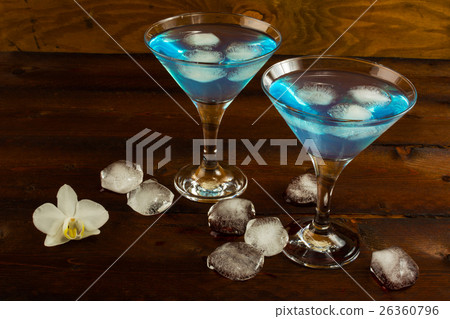 Blue cocktail in a martini glasses Blue cocktail in a martini glasses 26360796