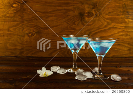 Blue curacao liqueur cocktail in a martini glasses Blue curacao liqueur cocktail in a martini glasses 26360800