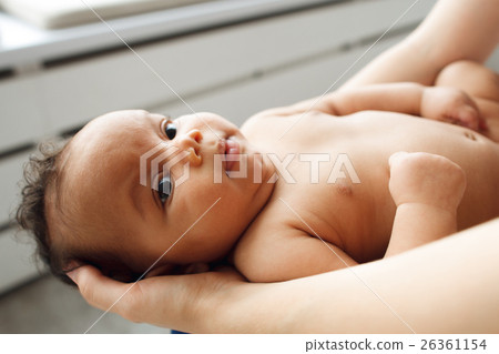 Adorable african baby on mother hands Adorable african baby on mother hands 26361154