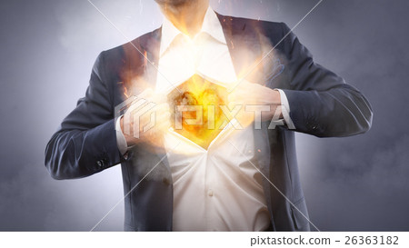 Businessman showing a burning heart 26363182