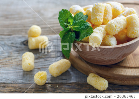 Bowl with sweet corn sticks and mint. 26363465