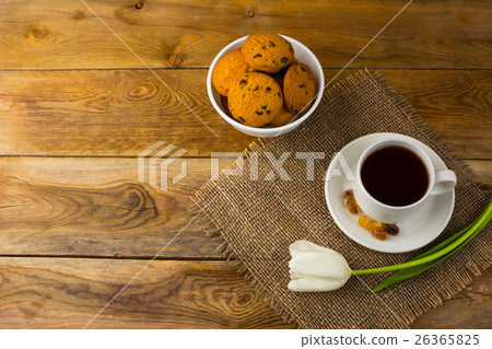 Tea cup and biscuits on sackcloth, top view 26365825