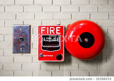 Fire alarm switch on brick wall texture background 26366019