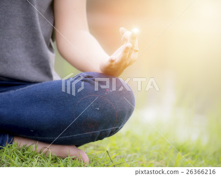 Young woman doing yoga in the park Young woman doing yoga in the park 26366216