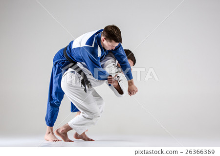 The two judokas fighters fighting men 26366369