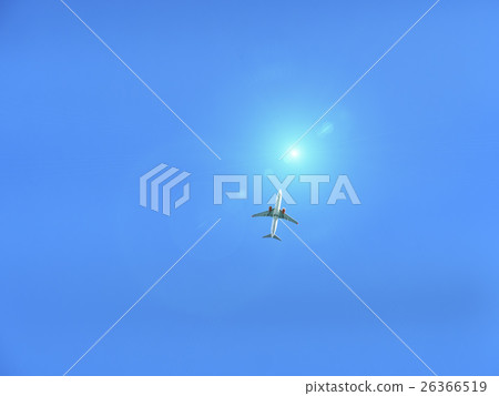 Flying plane in blue sky with sunray Flying plane in blue sky with sunray 26366519