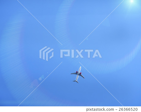 Flying plane in blue sky with sunray Flying plane in blue sky with sunray 26366520