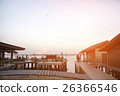 houses on piles on water at the time sunset 26366546