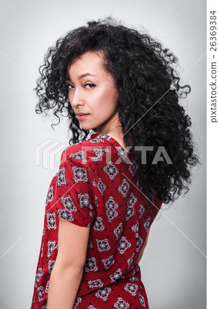 Young woman with curly black hair Young woman with curly black hair 26369384