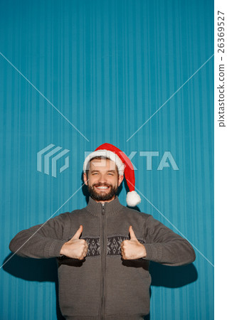 Smiling christmas man wearing a santa hat 26369527
