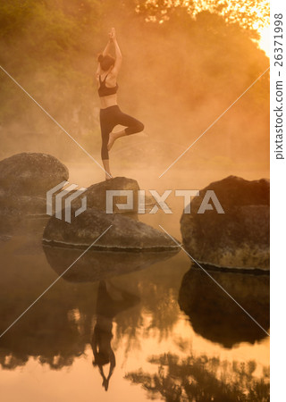 Asian young woman practicing yoga Asian young woman practicing yoga 26371998