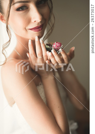 Beautiful young bride with makeup and hairstyle in Beautiful young bride with makeup and hairstyle in 26373017