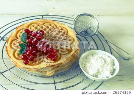 stacked homemade waffles to cool stored 26374339