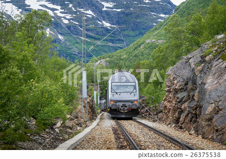 Flamsbana railway train arriving at small rural Flamsbana railway train arriving at small rural 26375538