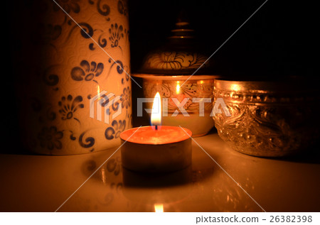 Couple candle lights and the beautiful pots 26382398
