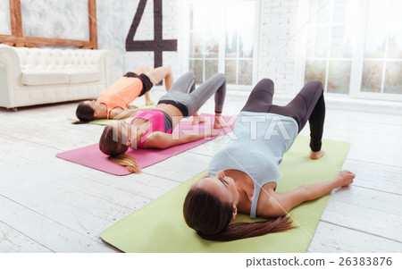 Three pretty girls enjoying group training 26383876