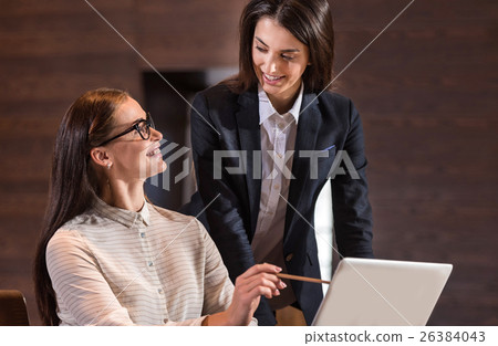 Female colleagues cooperating in an office 26384043