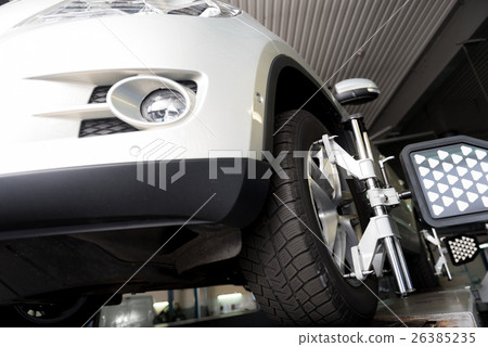 Low angle of car wheel fixed in alignment machine Low angle of car wheel fixed in alignment machine 26385235