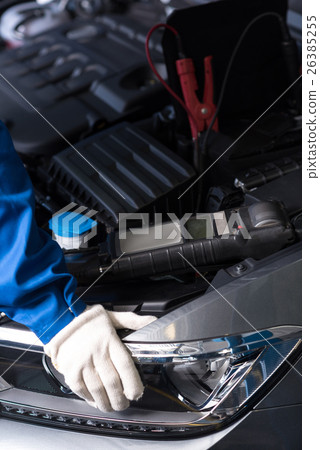 Professional mechanic examining car engine Professional mechanic examining car engine 26385255